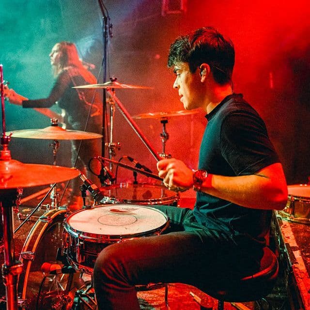 Elias Luyckx performing live on drums